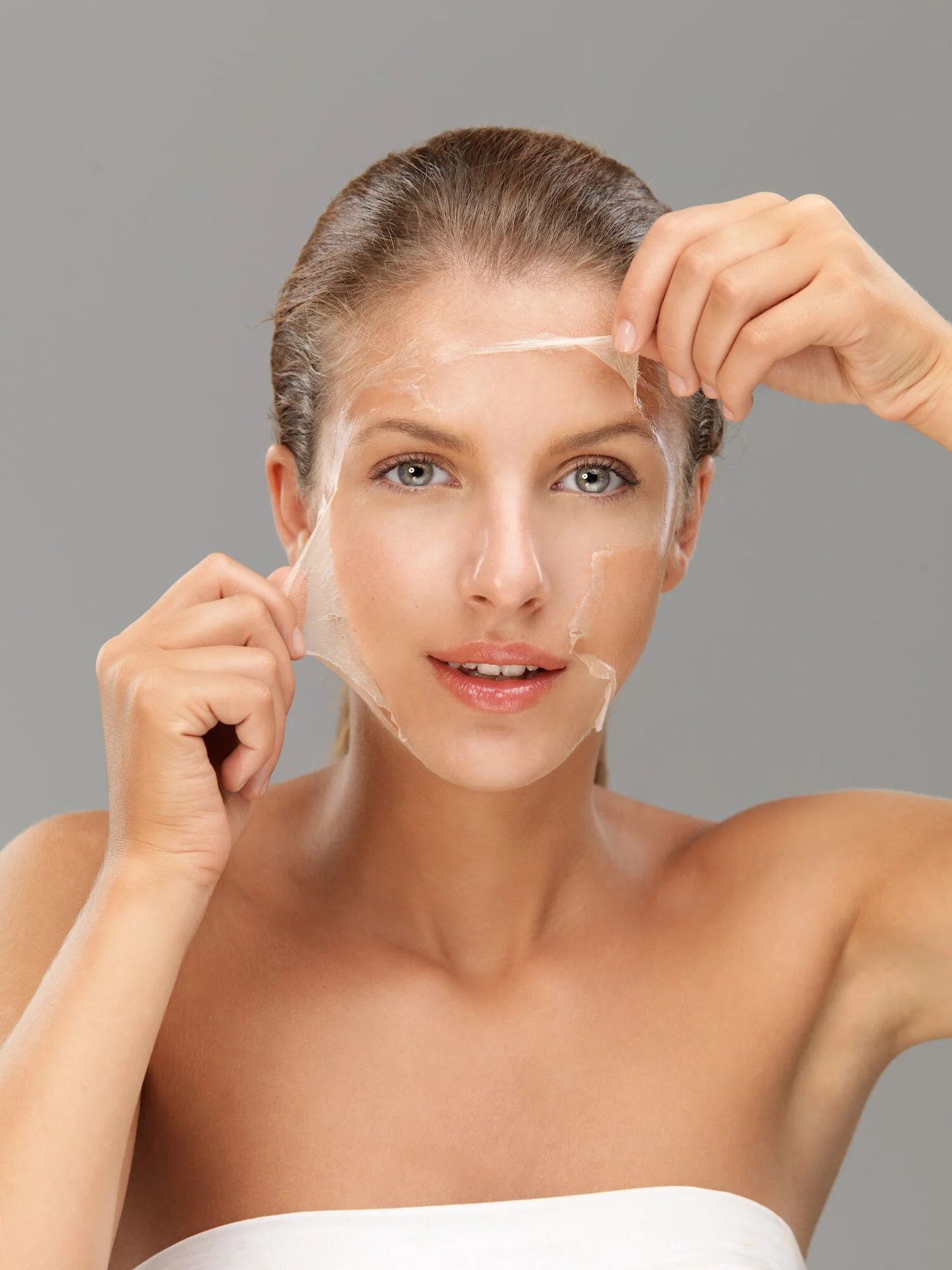 young-woman-taking-off-peeling-mask-e1690989274855
